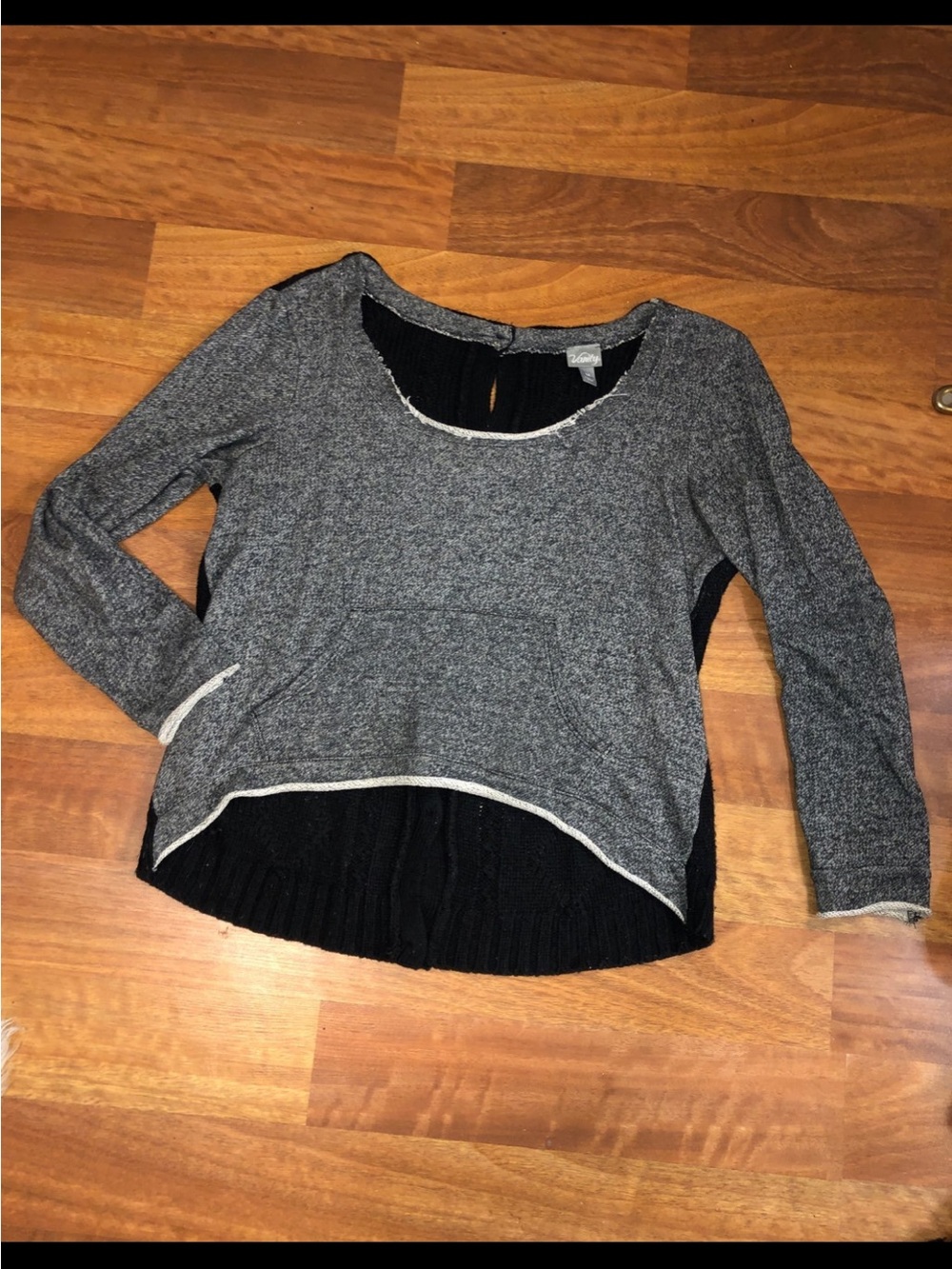 Vanity sweater with front pocket and button back